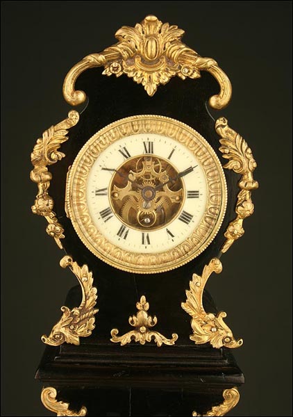 Rococo Mantle Clock. Ebonised Wood and Brass ca.1900  